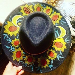 Hand painted hat with 🌝 phases and sunflowers 🌻.